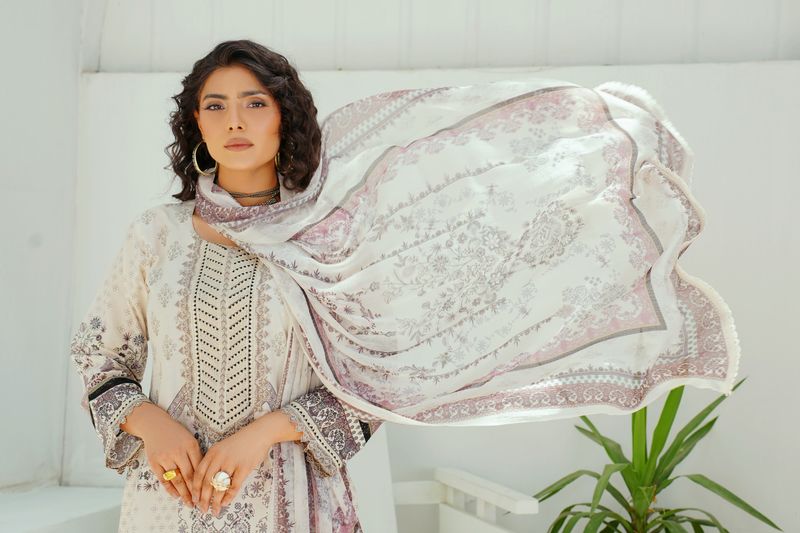 woman in a taupe satin dress with a shawl