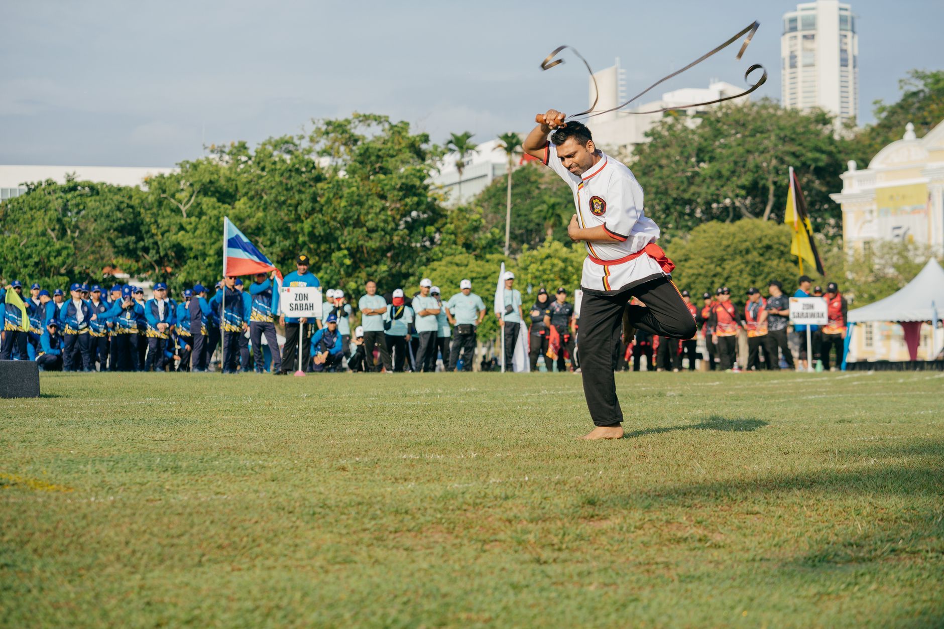 A martial artist demonstrates a urumi whip sword during a cultural performance in George Town, Penang.