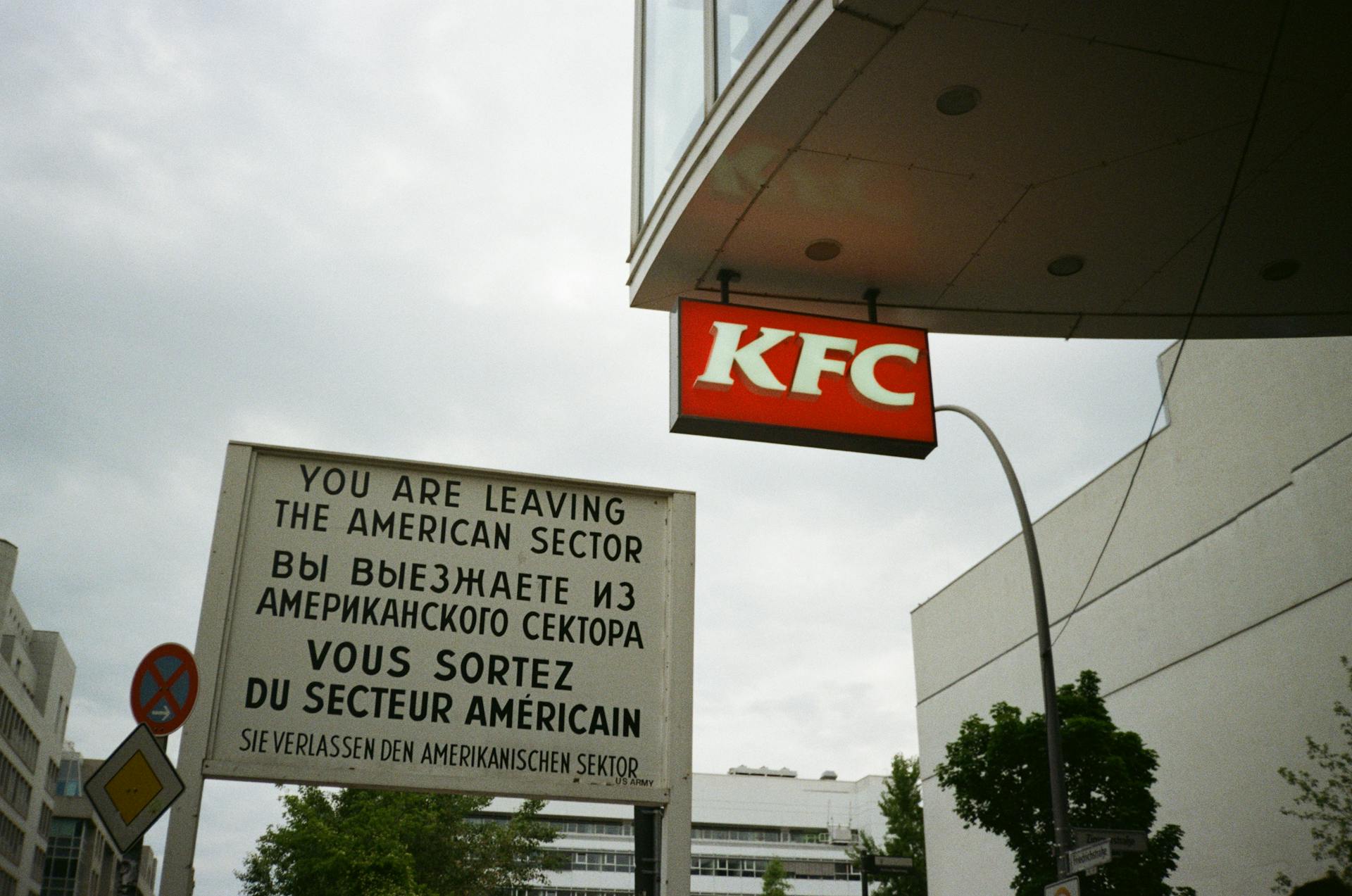 Information Sign near KFC Logo on Wall