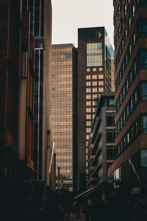 Free A striking view of modern skyscrapers in an urban cityscape during daytime. Stock Photo