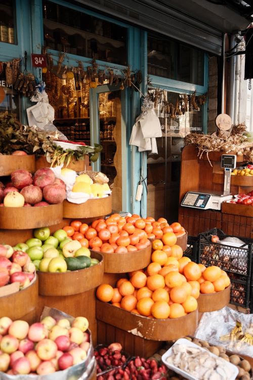 Free Vibrant produce market in Istanbul showcasing fresh fruits and a traditional shopping atmosphere. Stock Photo