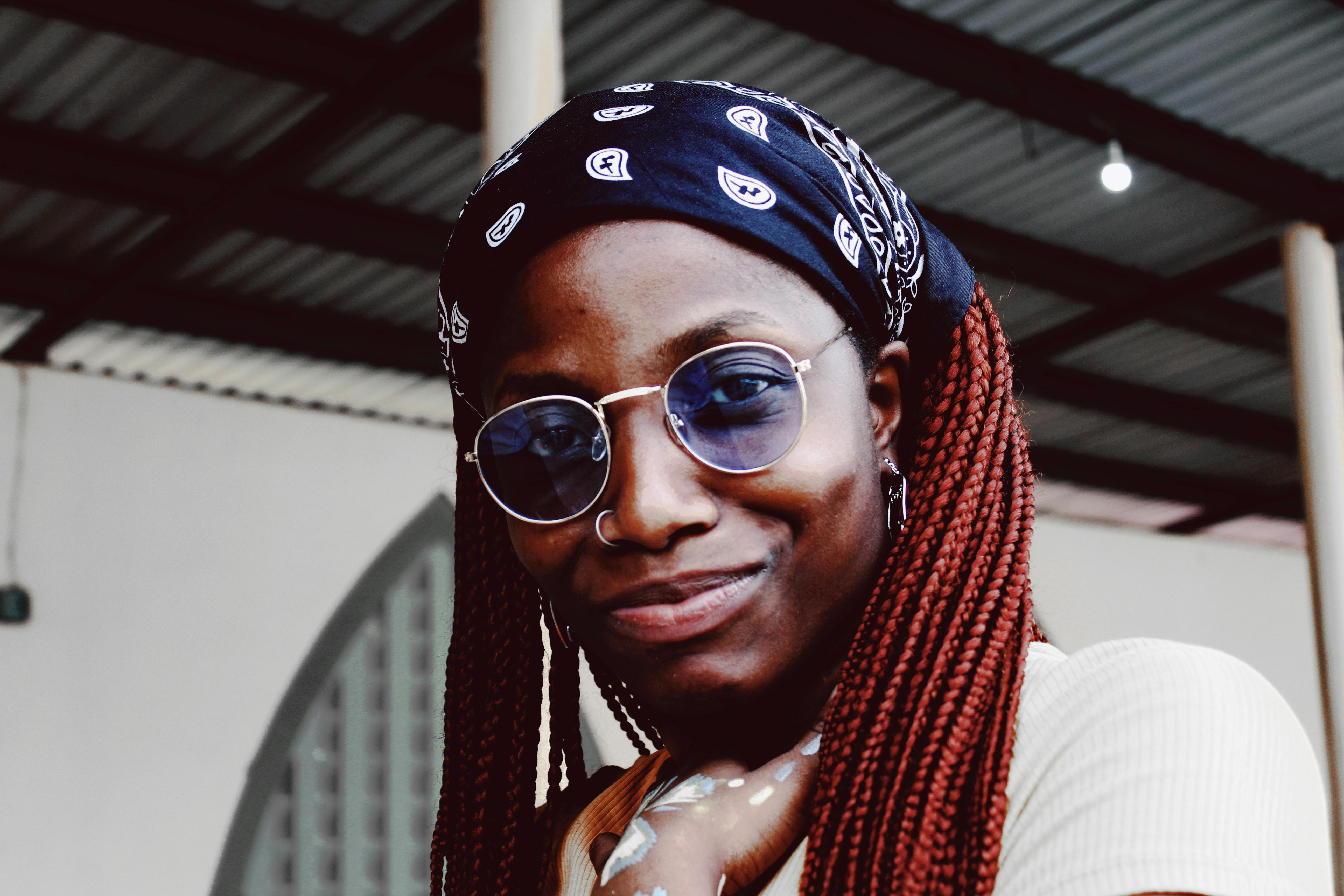 Portrait Photo of Smiling Woman in Sunglasses and Bandana Posing