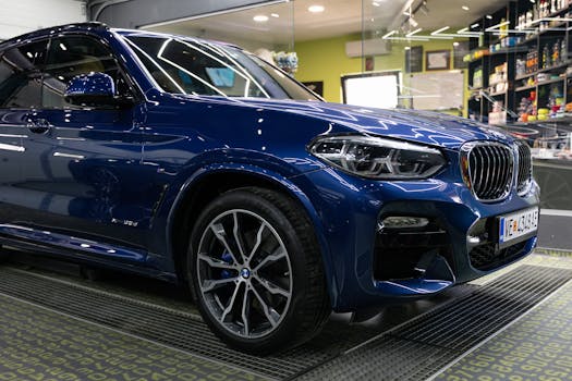 Detailed image of a luxury blue SUV parked in a modern garage with sleek design elements.