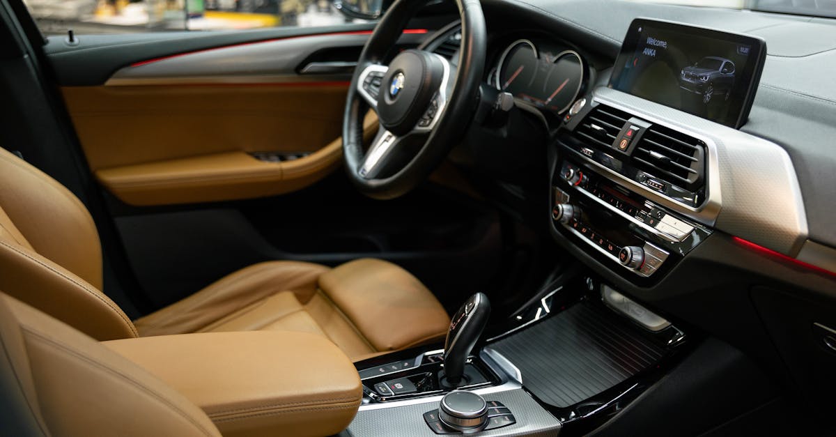 Luxurious car interior featuring plush leather seats and modern dashboard technology.