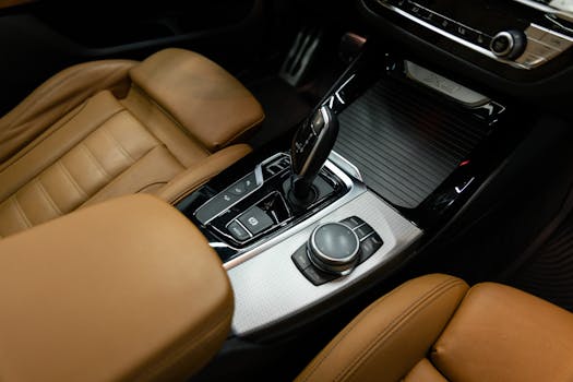 Explore the sophisticated design of a BMW car interior featuring premium brown leather seats and modern controls.