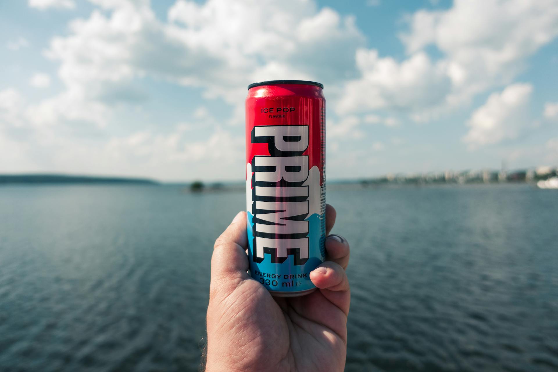 Can of Prime Energy Drink Against the Sea