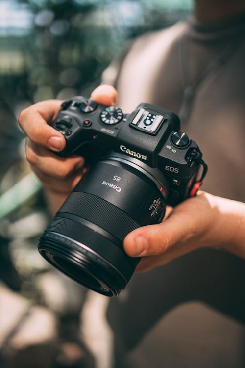 Canon EOS in the Hands of a Photographer
