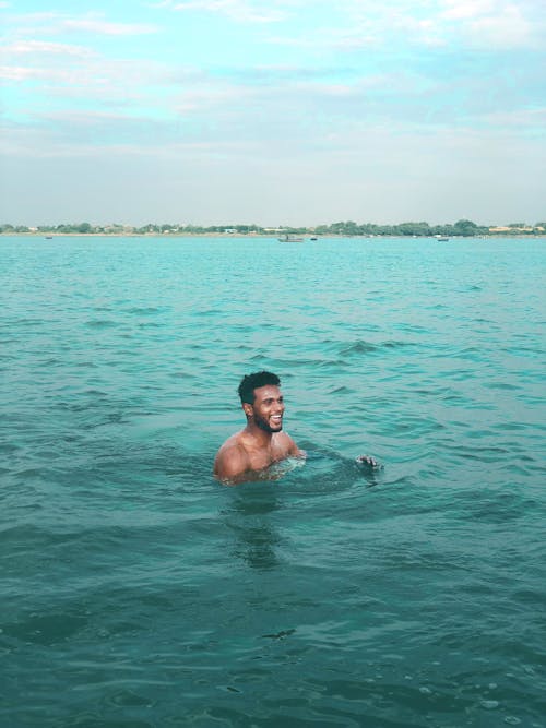 Man Swimming on the Ocean