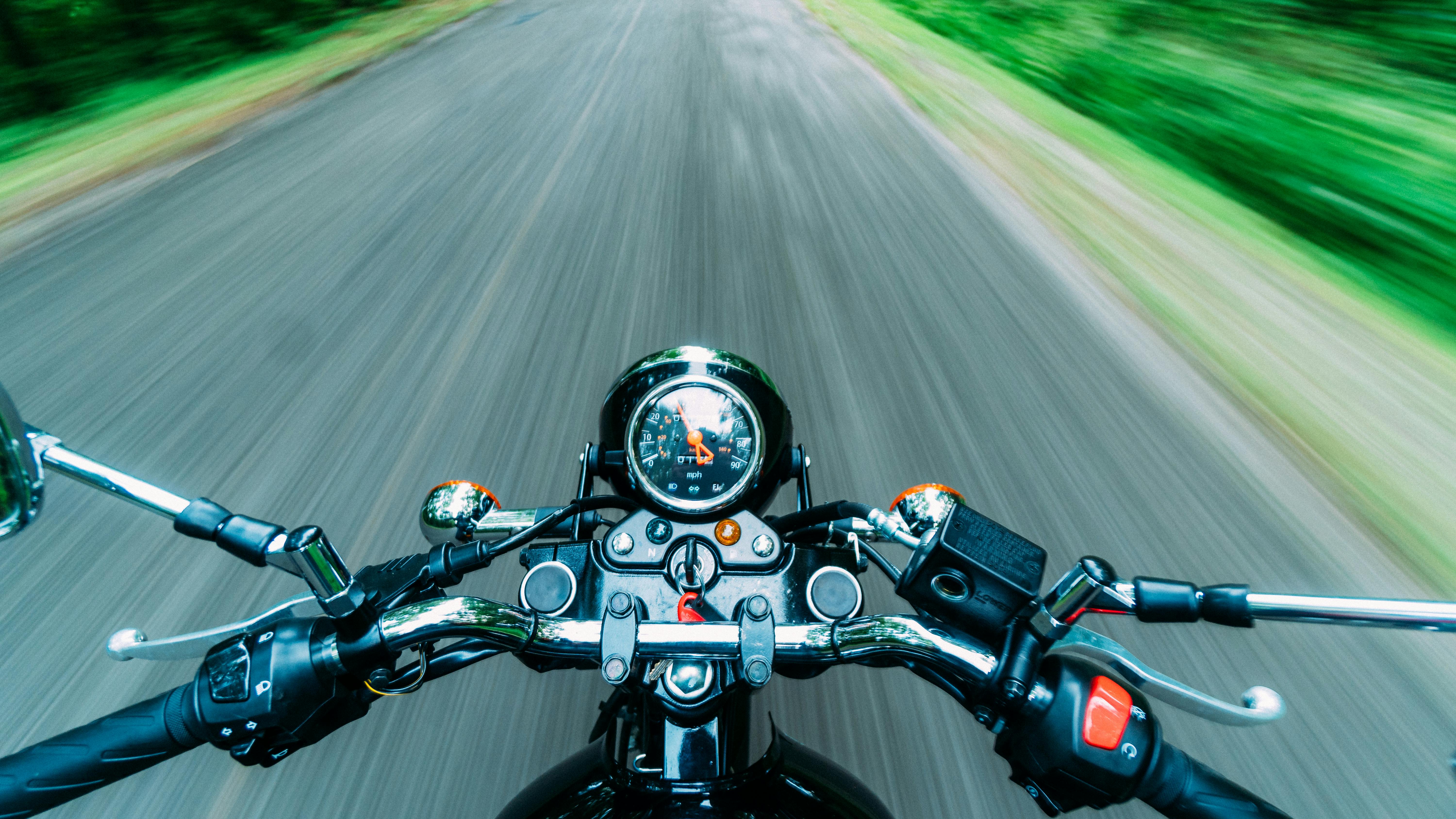 black motorcycle on road