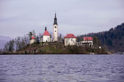 Free Scenic view of Bled Island with the church and Bell Tower on Lake Bled, Slovenia. Stock Photo