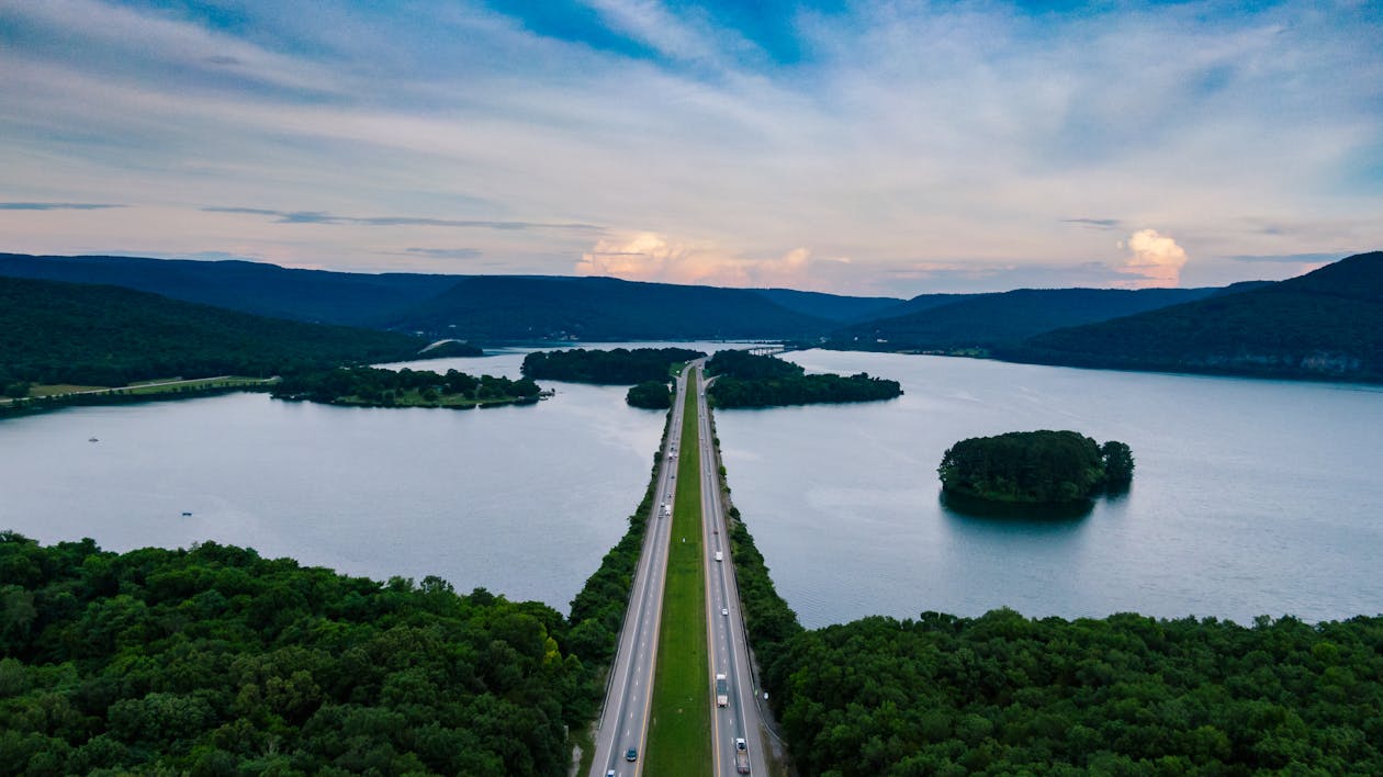 Aerial Photography of Road Surrounded by Body of Water