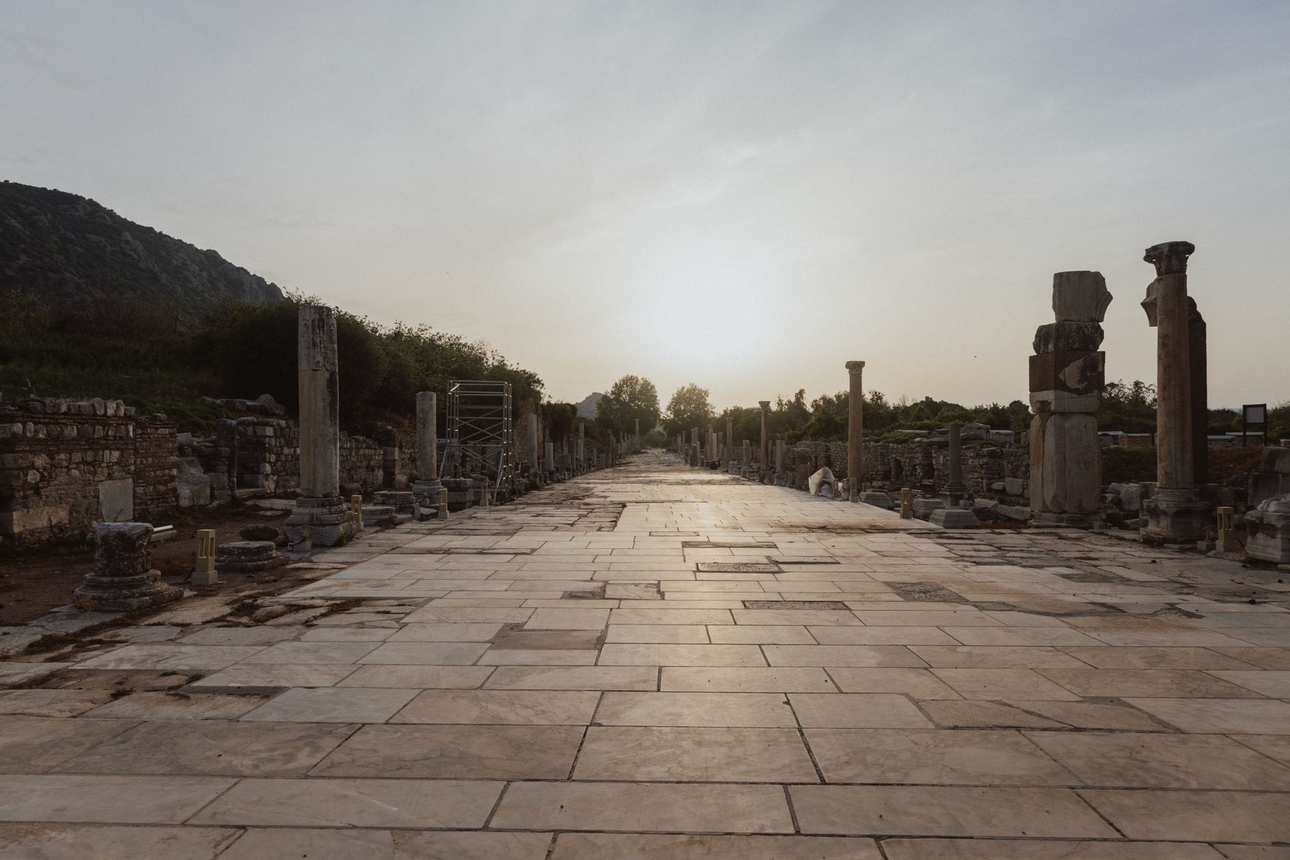 Experience the serene beauty of Ephesus ruins at sunset, capturing the essence of ancient history.
