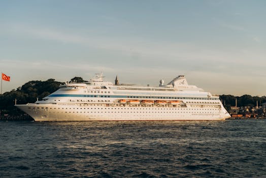 Experience luxury aboard the Astoria Grande cruise ship sailing past Istanbul's iconic shoreline at sunset.
