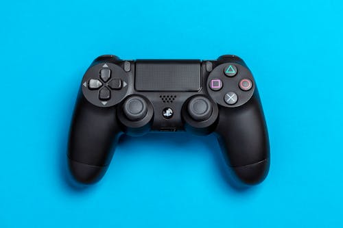 Plat Lag Foto Van Zwarte Sony Ps4 Gamecontroller Op Blauwe Achtergrond