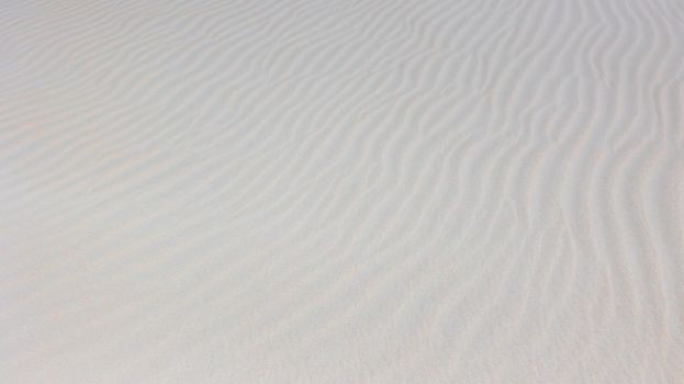 Peaceful sand patterns shaped by the wind at Sankt Peter-Ording, Germany.
