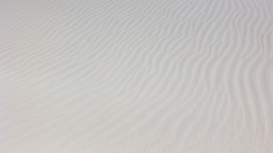 Peaceful sand patterns shaped by the wind at Sankt Peter-Ording, Germany.