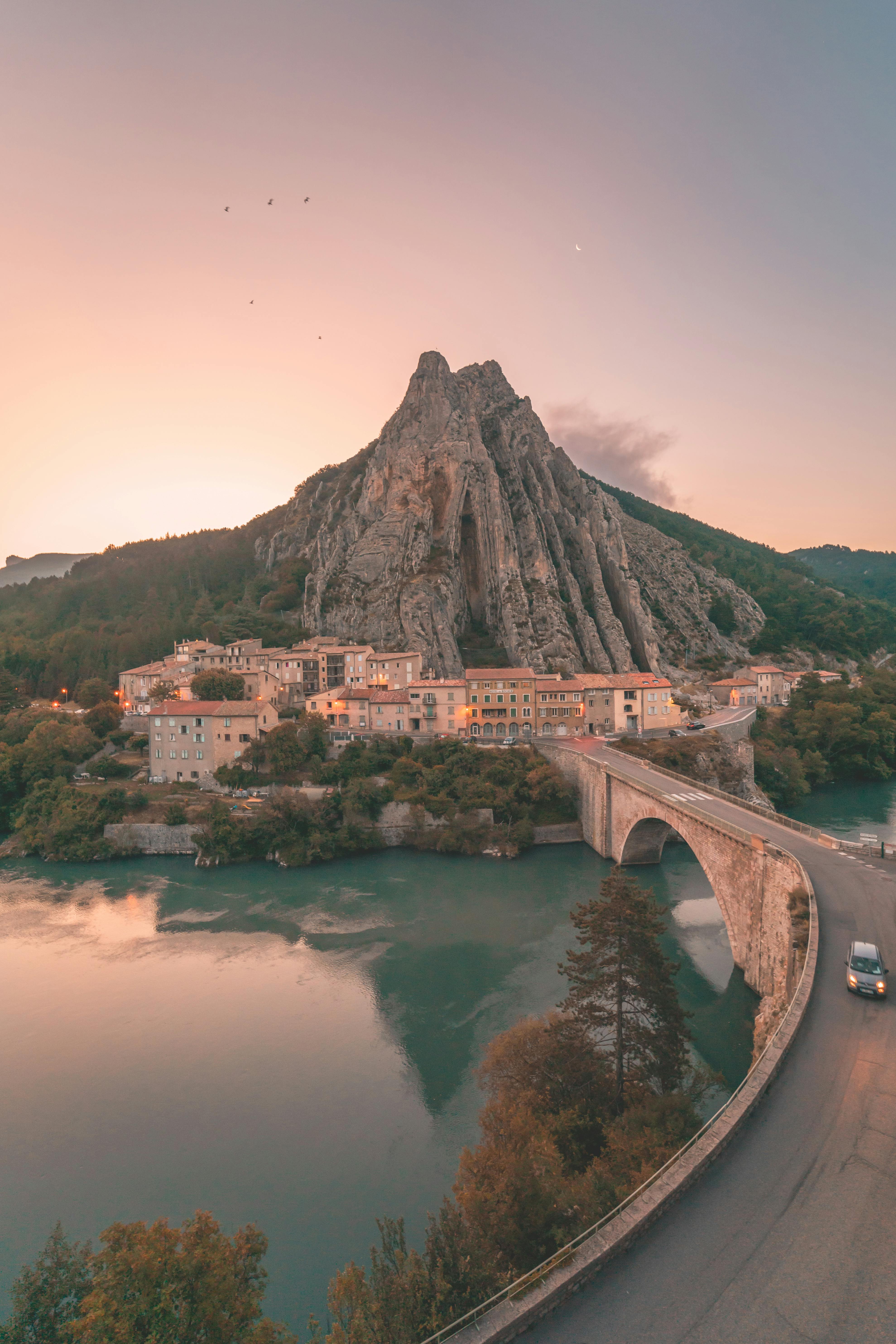 clear sky over rocher de la baume town in france at sunset