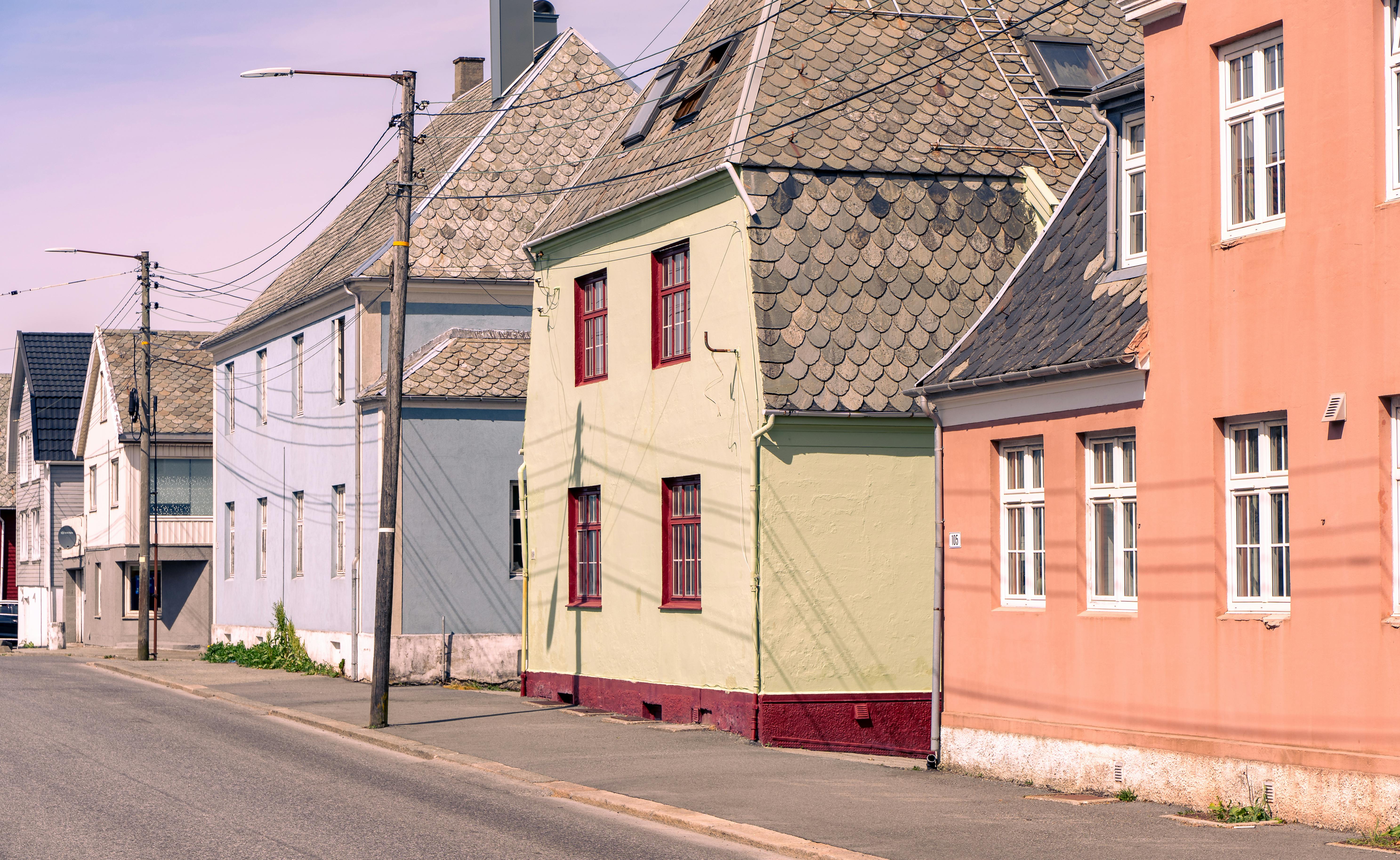 Colorful historic houses line the quiet streets of Haugesund, Norway.