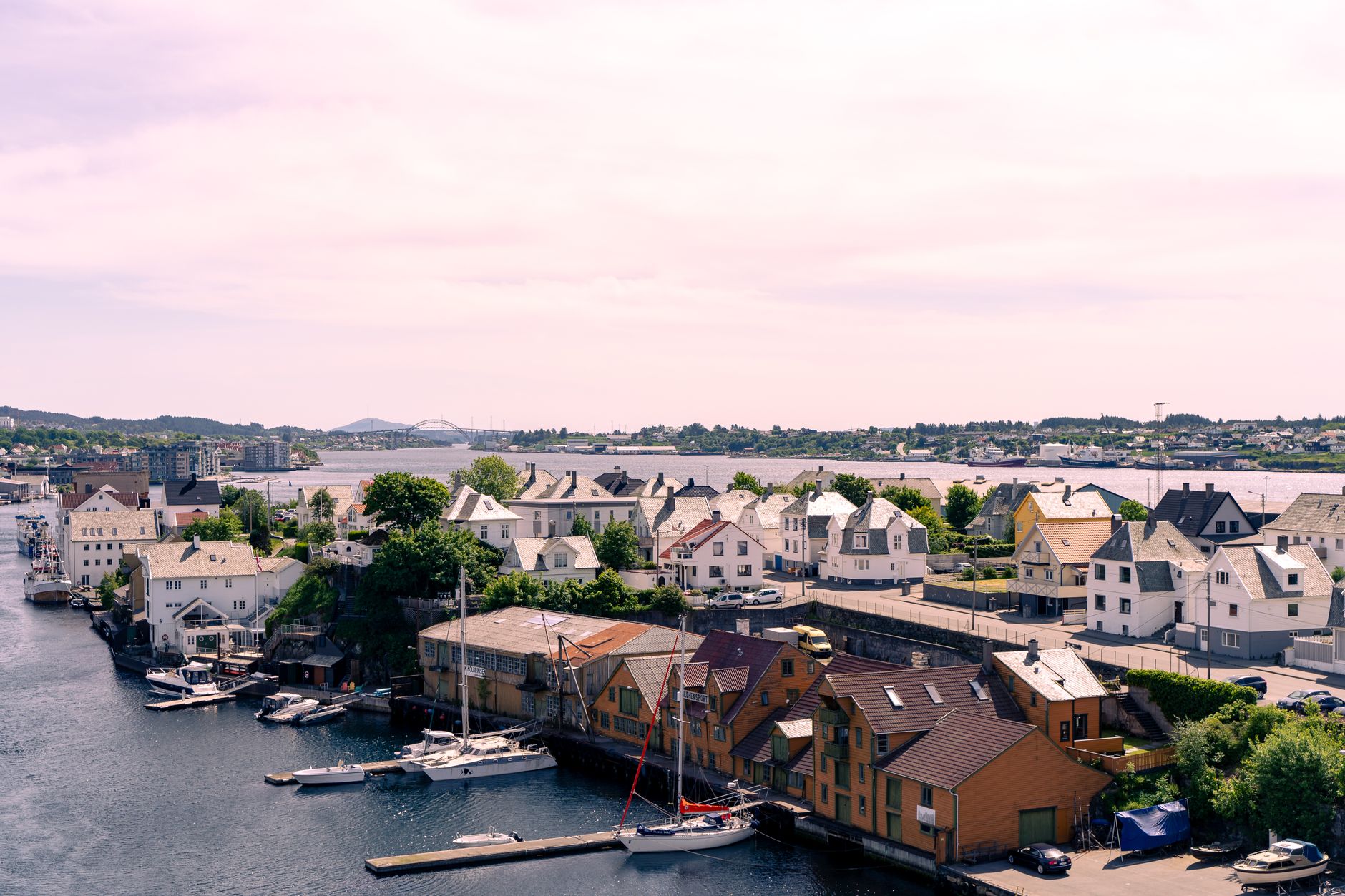 Aerial view of Haugesund, Norway showcasing charming houses and a picturesque waterfront scene.