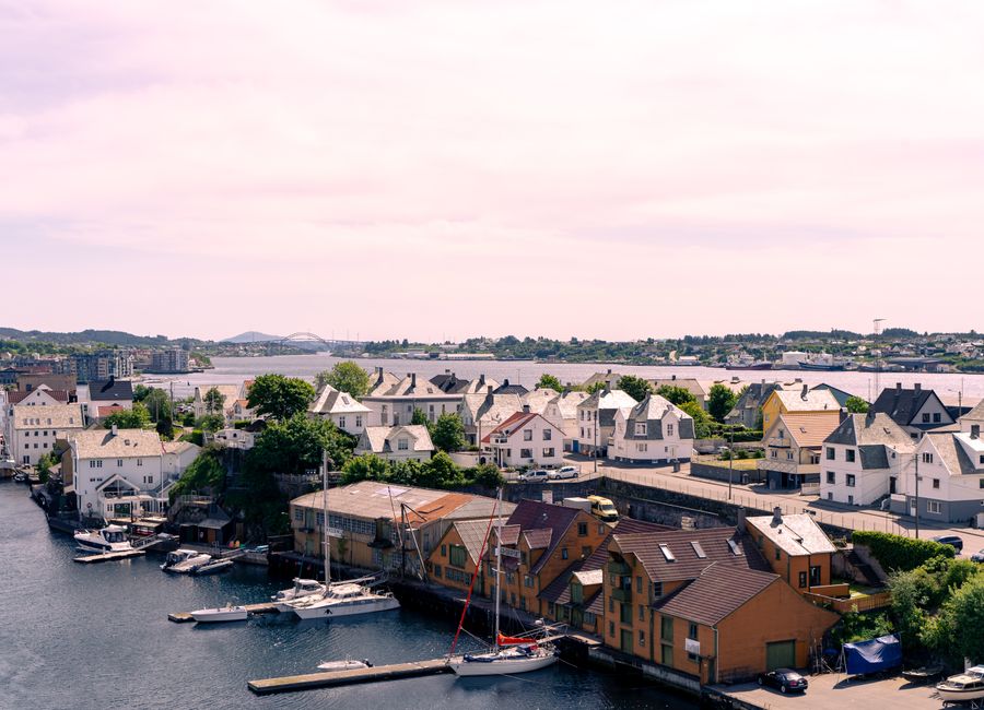 Aerial view of Haugesund, Norway showcasing charming houses and a picturesque waterfront scene.