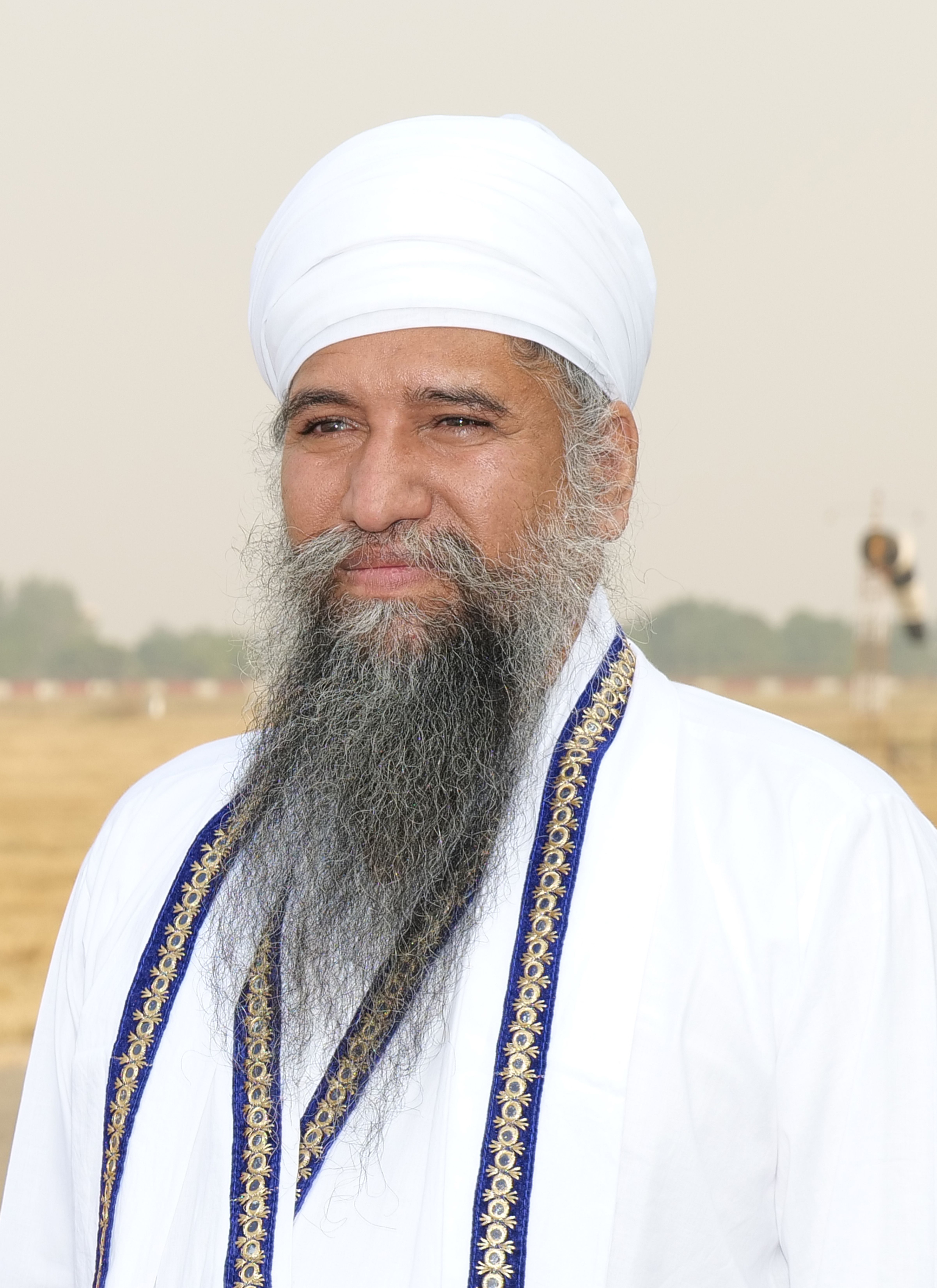 Portrait of an elderly Sikh man in traditional clothing, showcasing cultural heritage.