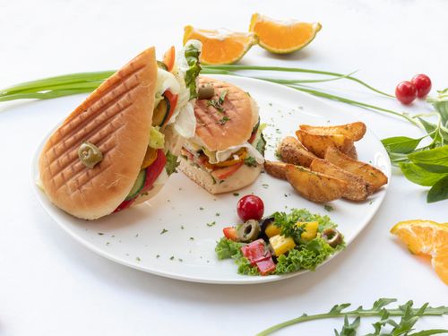 Free Delicious sandwich with potato wedges and salad, perfect for a light lunch. Stock Photo