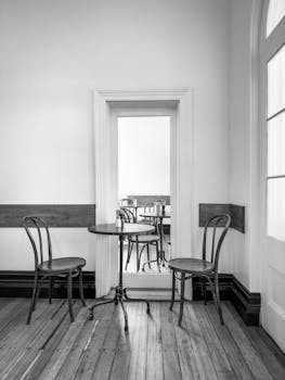 A black-and-white photo of a minimalist café interior in Hobart, TAS, Australia.