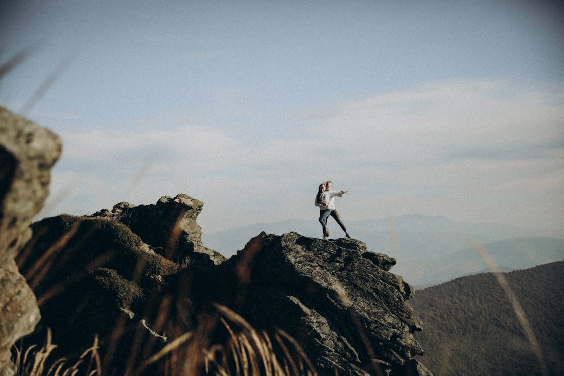 A person standing on top of a mountain