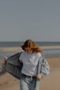 Blurred Woman Walking in Jacket and T-shirt