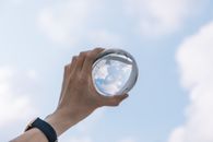Crop male holding glass bulb in hand