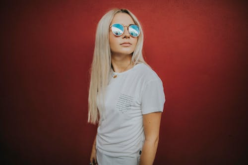 Photo of Woman Wearing Blue-lens Sunglasses