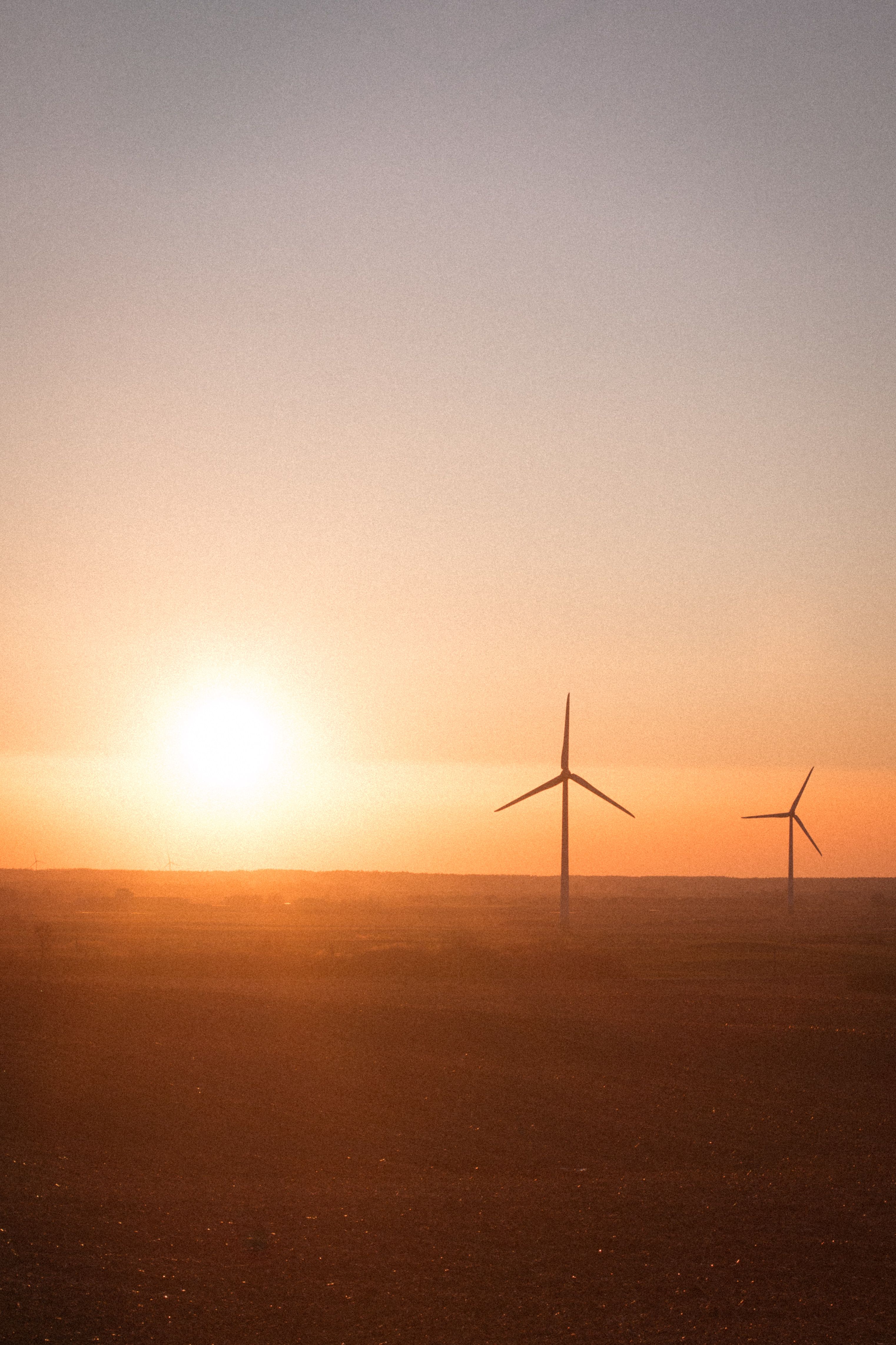 Silhouetted Wind Turbines at Sunset · Free Stock Photo