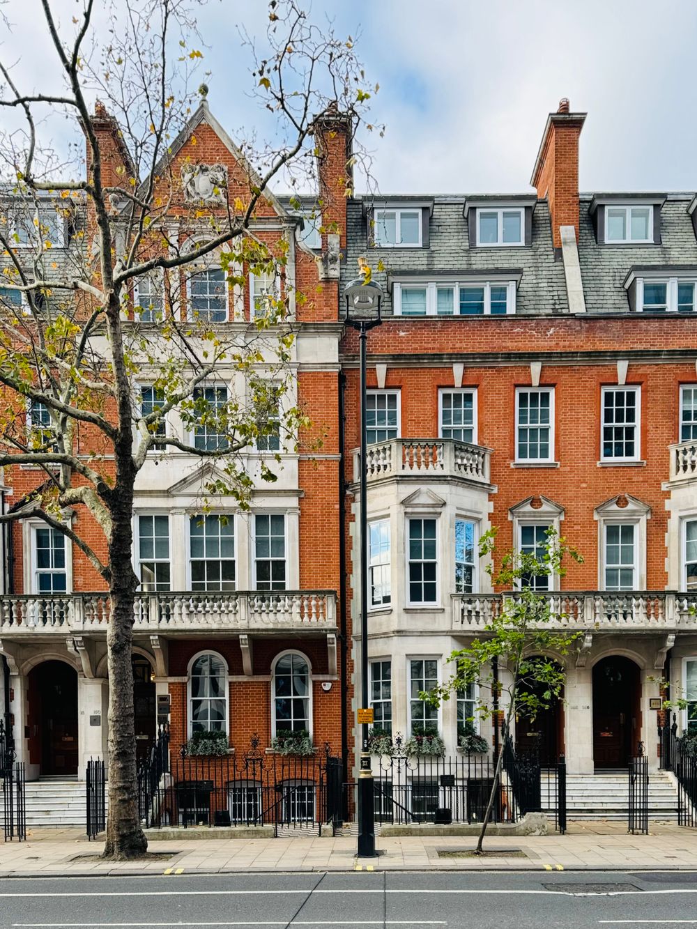 Brick terraced houses along a London street