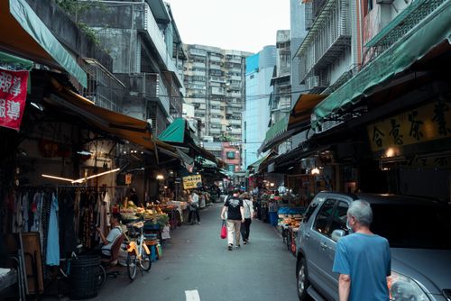 Free Bustling Taipei street market with shops, people, and urban vibe, capturing local daily life. Stock Photo