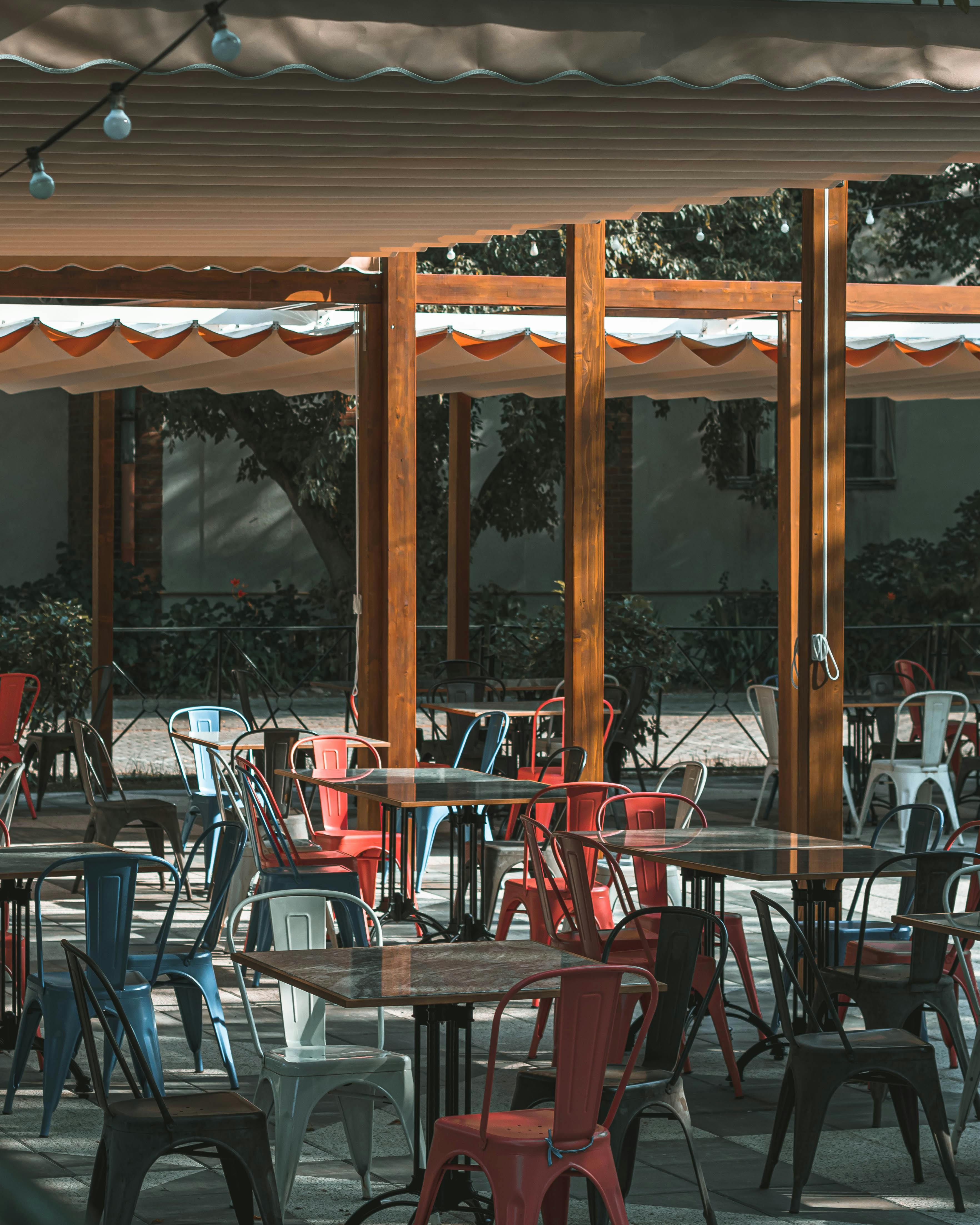 Tables and Chairs Under Canopy · Free Stock Photo