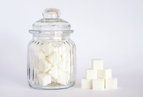 Free Close-Up Photo of Sugar Cubes in Glass Jar Stock Photo