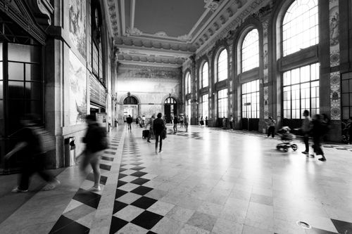 Free Black and white capture of bustling commuters in São Bento Railway Station, Porto, Portugal. Stock Photo