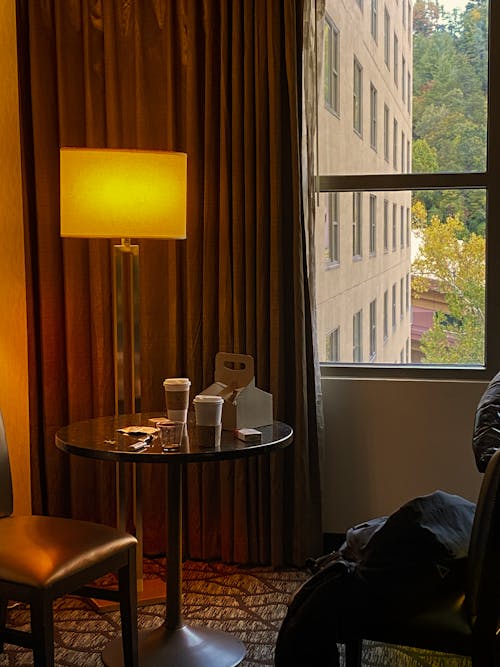 A man sitting in a chair by a window