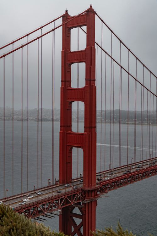 Free Iconic Golden Gate Bridge captured on a foggy day in San Francisco, showcasing its architectural beauty. Stock Photo