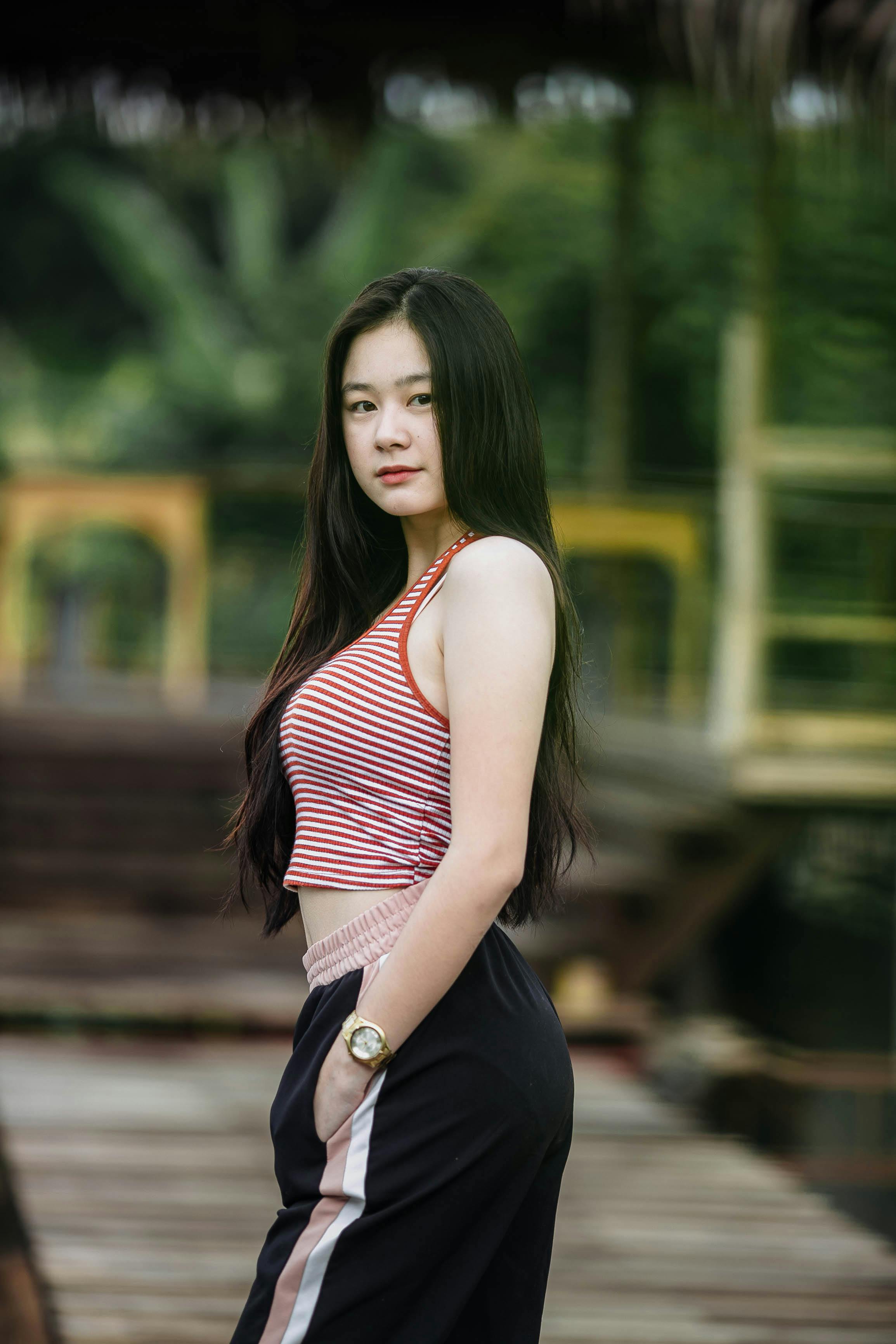 Selective focus photo of a woman wearing red and white striped