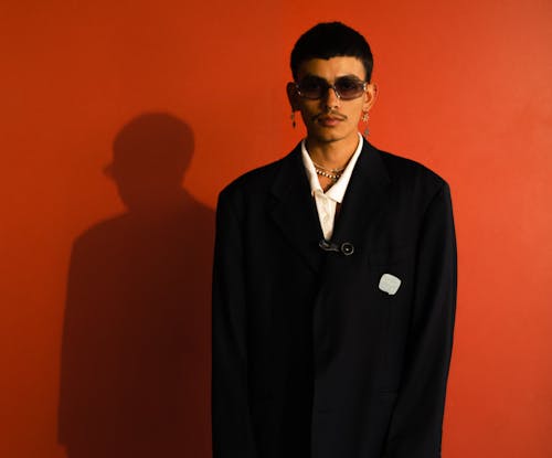 Model in an Oversized Suit Jacket with Earrings and Nose Rings
