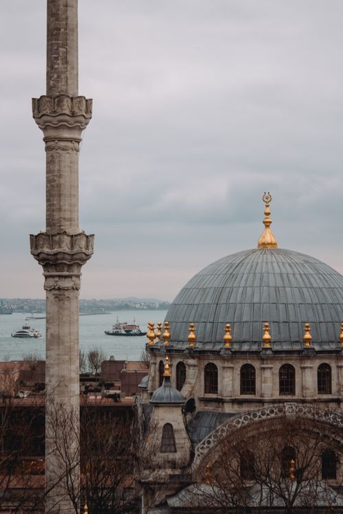 Free Scenic view of Nusretiye Mosque with Bosphorus Strait in the background on an overcast day in Istanbul, Turkey. Stock Photo