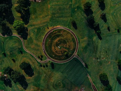 Free Aerial shot of Chattanooga National Cemetery showcasing circular road design and lush greenery. Stock Photo