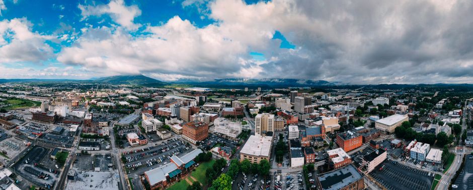 Stunning aerial view of Chattanooga's urban landscape with mountainous backdrop.