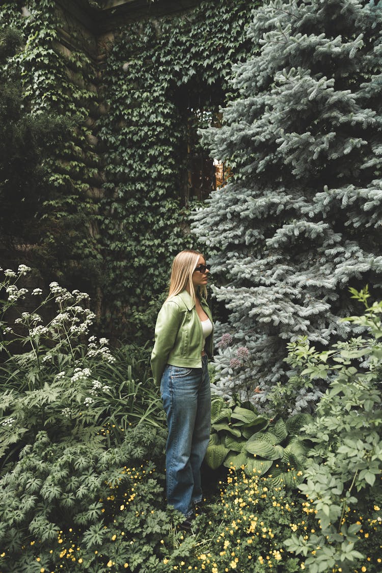 A Woman Standing In The Garden 