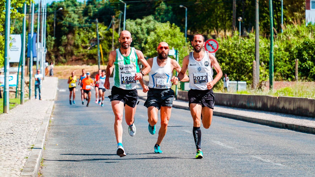 Men Running on Asphalt Road · Free Stock Photo