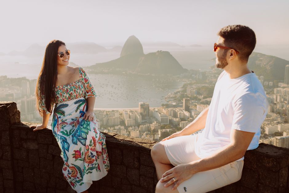 A happy couple enjoying the panoramic view of Rio de Janeiro's iconic skyline.