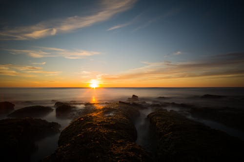 Free Body Of Water During Sunset Stock Photo