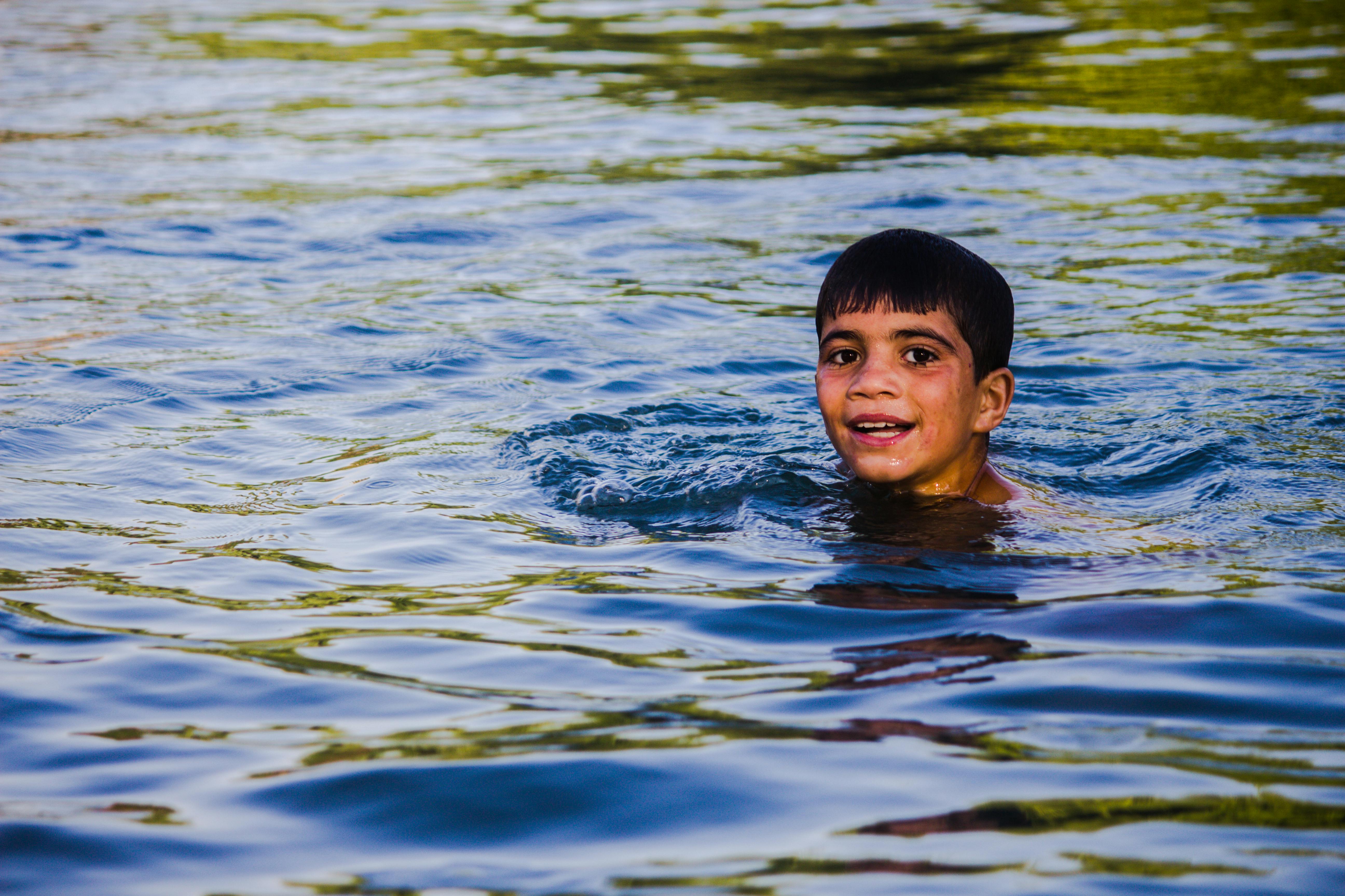 Children Playing On A Body Of Water Free Stock Photo