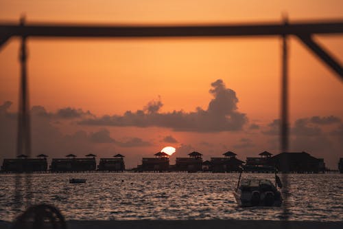 Silhouette Photography of Villas During Golden Hour